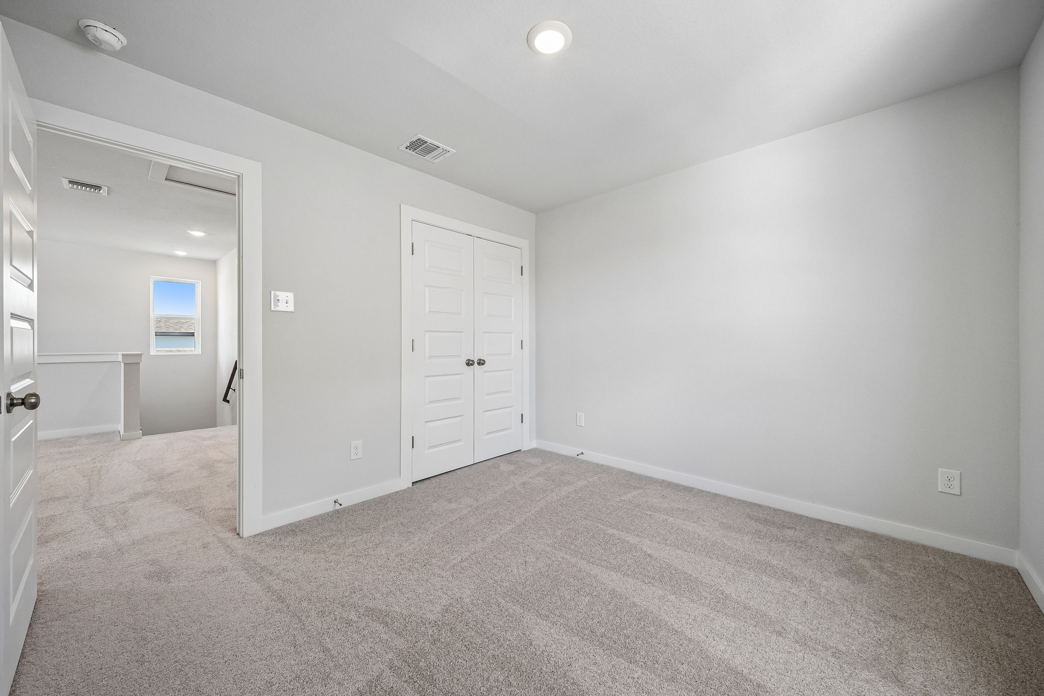 A room with white doors.