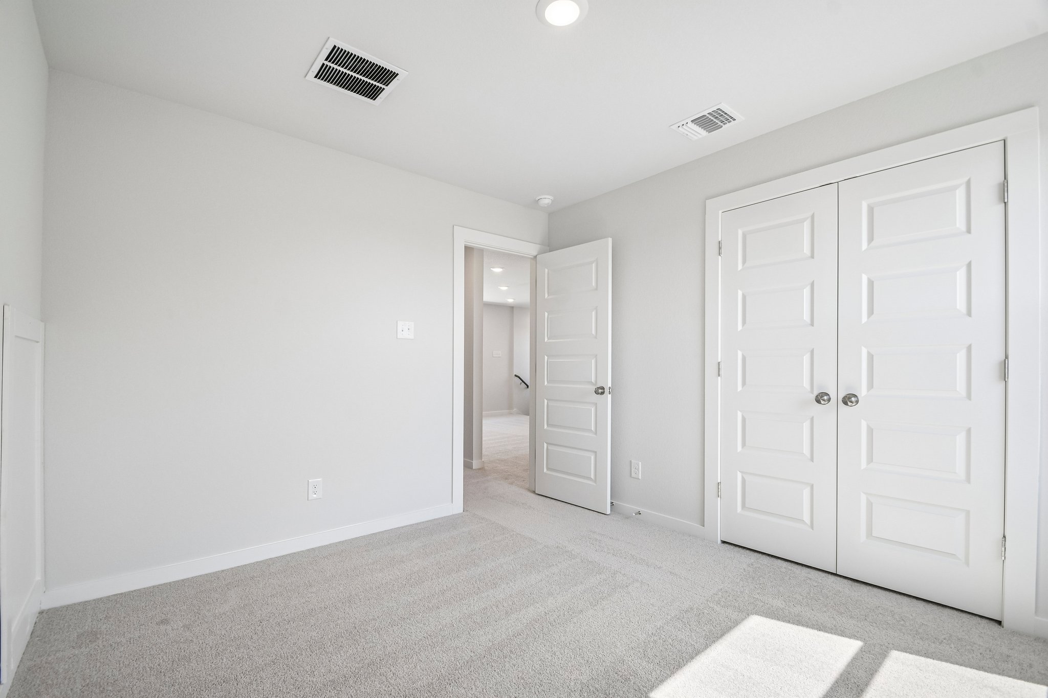 A room with white doors.