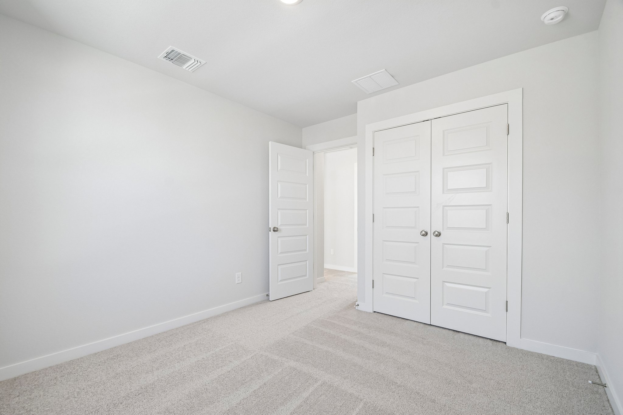 A room with white doors.