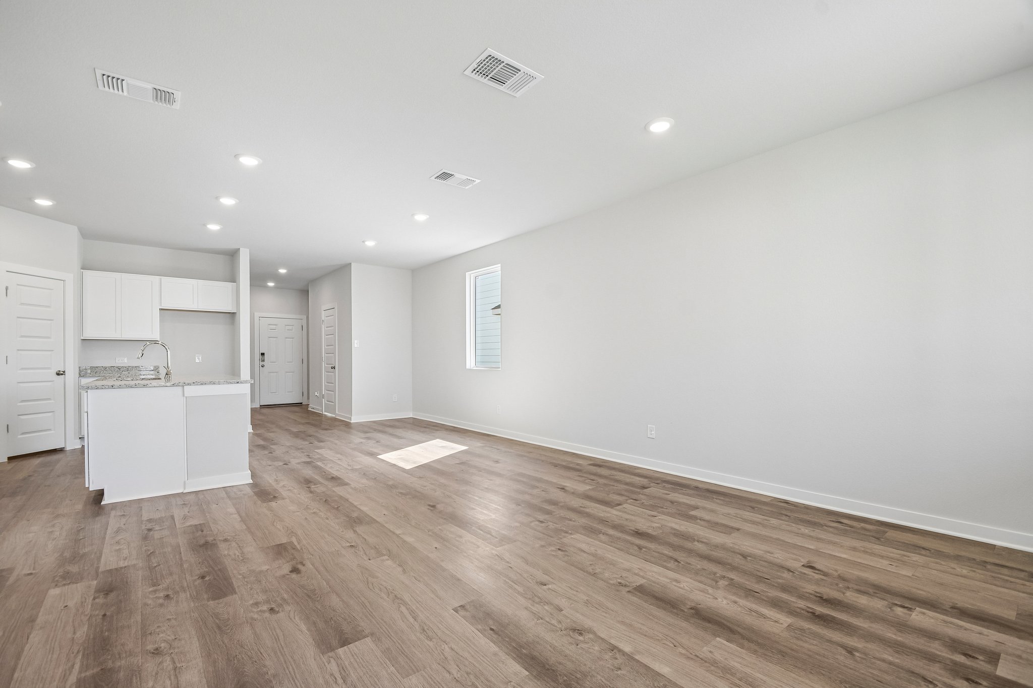 A room with white cabinets.