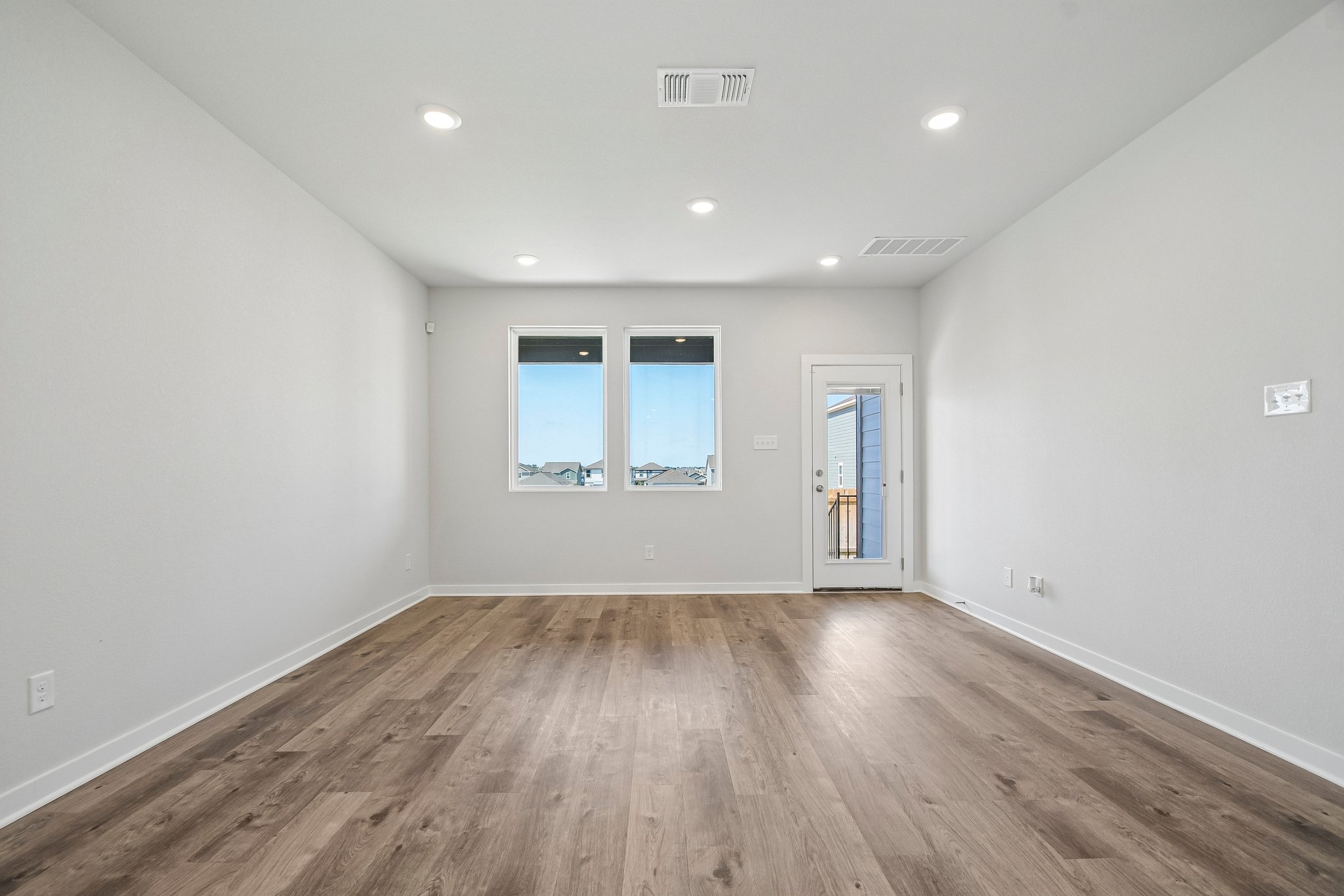 A room with a wood floor and a wood floor.