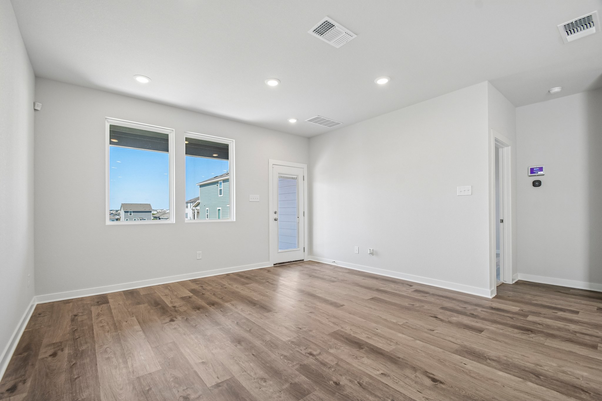 A room with a wood floor and a wood floor.