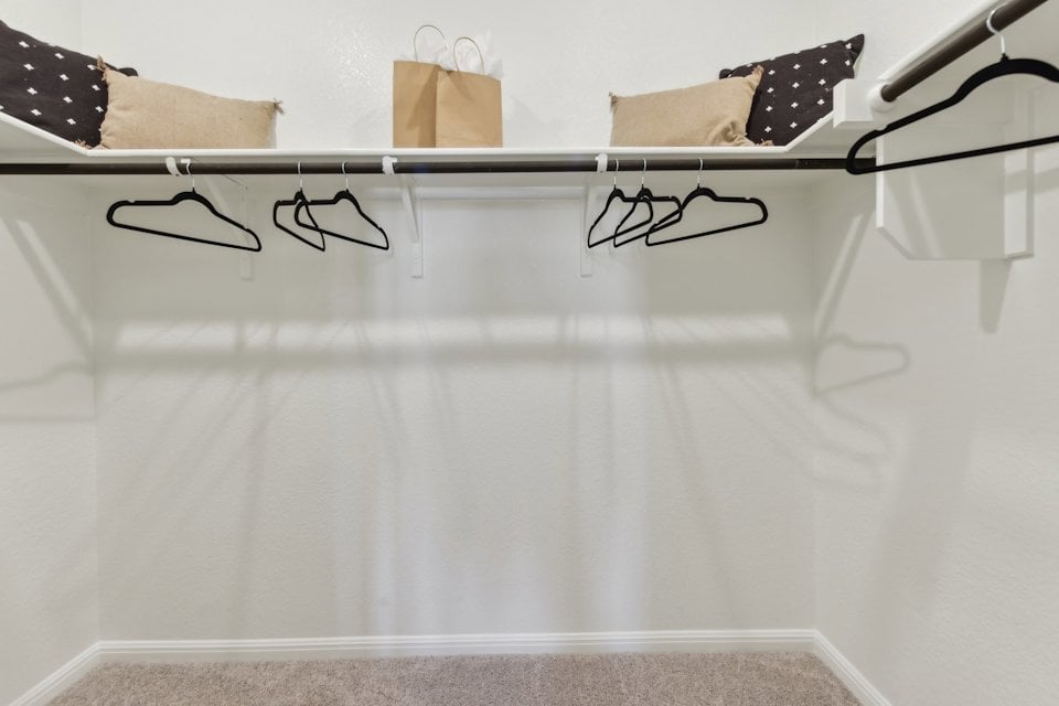 A white table with glasses.