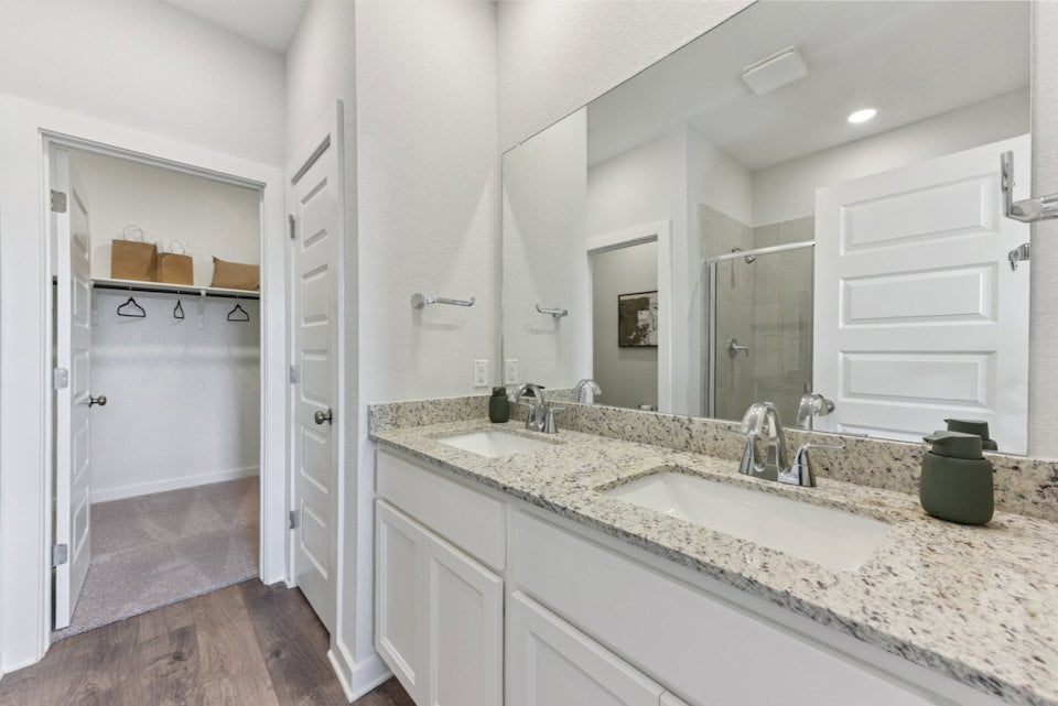 A bathroom with a marble countertop.