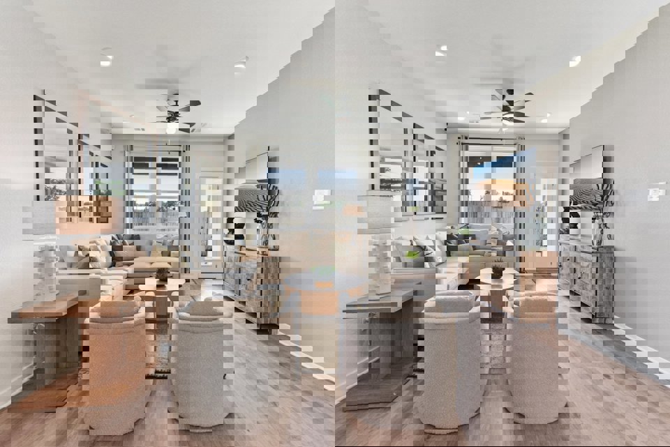 A living room with a large chandelier and a large window.