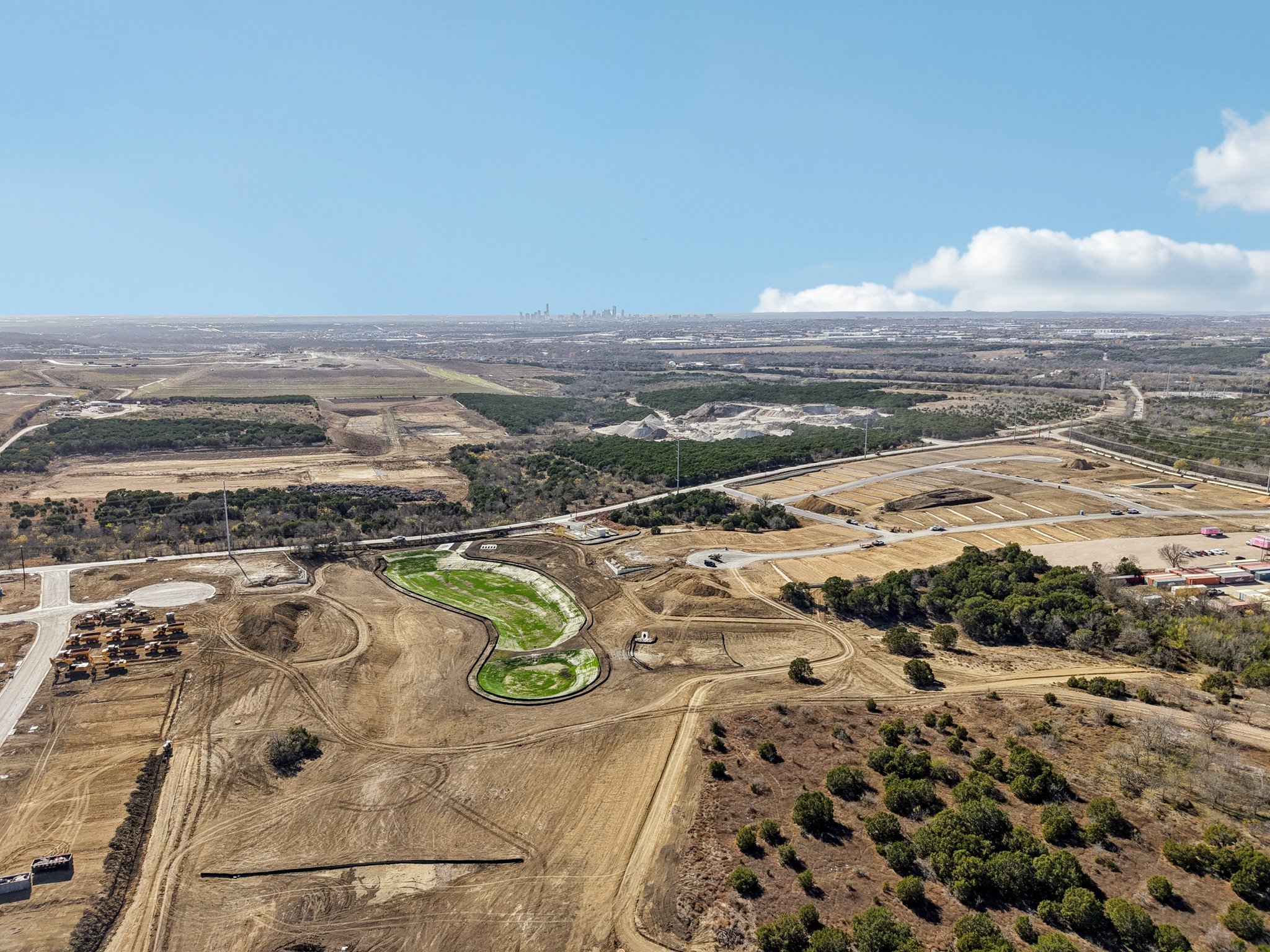 A landscape with trees and grass.