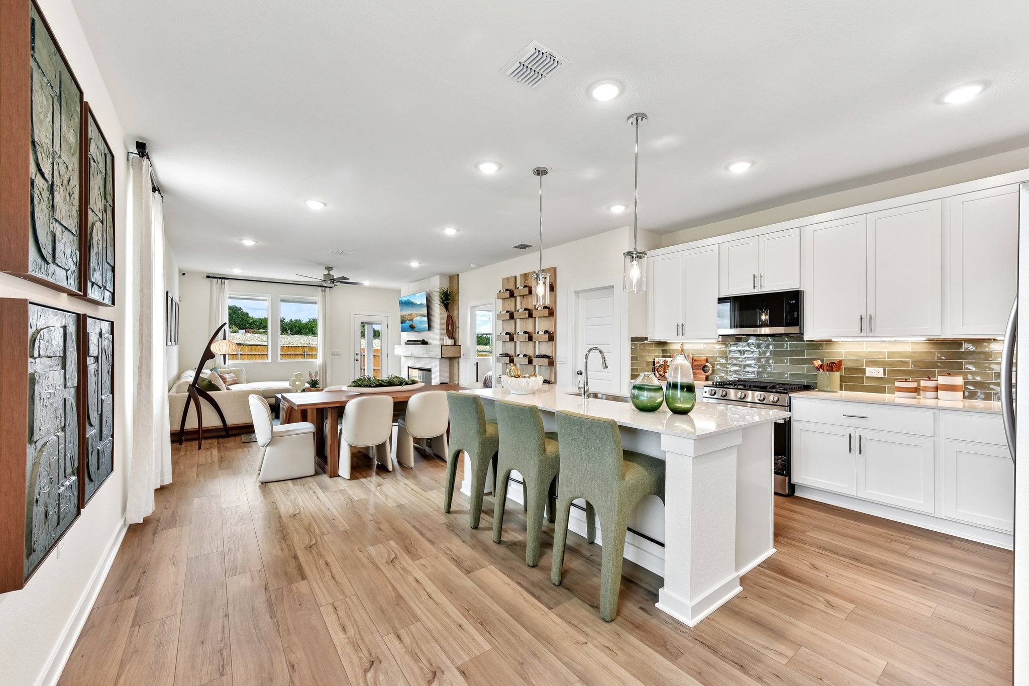 A kitchen with white cabinets.