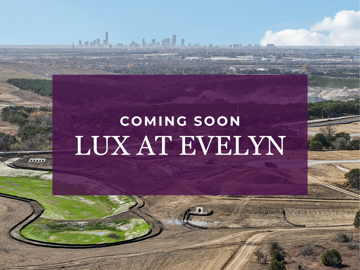 A landscape with a city in the background.