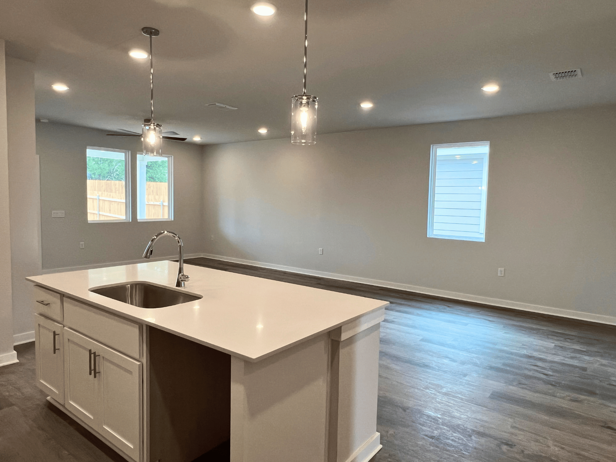 A kitchen with a sink and a countertop.