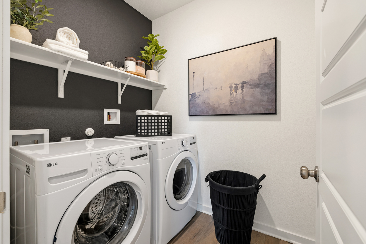 A laundry room with a washer and dryer.