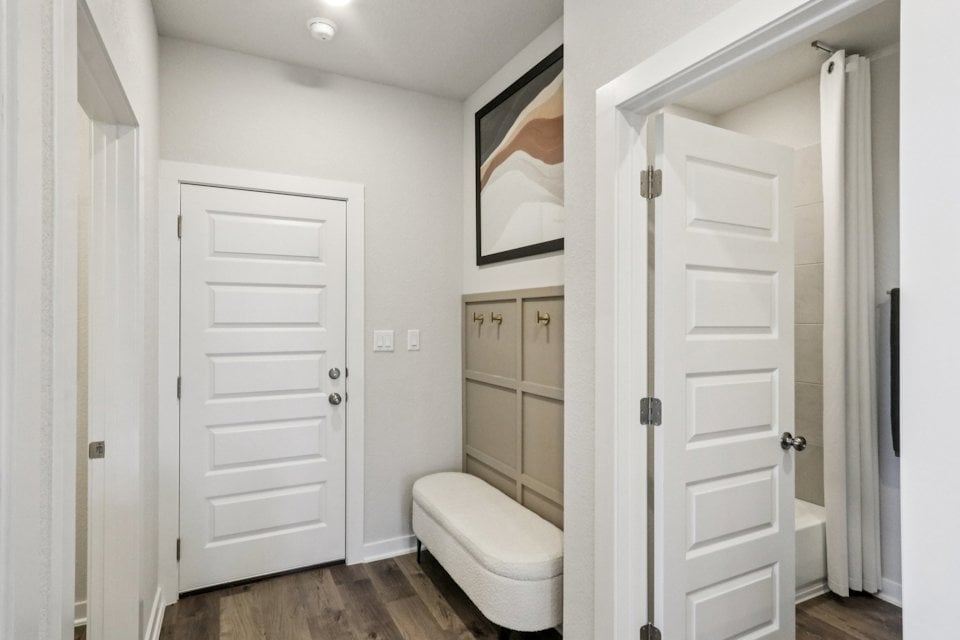 A bathroom with white doors.