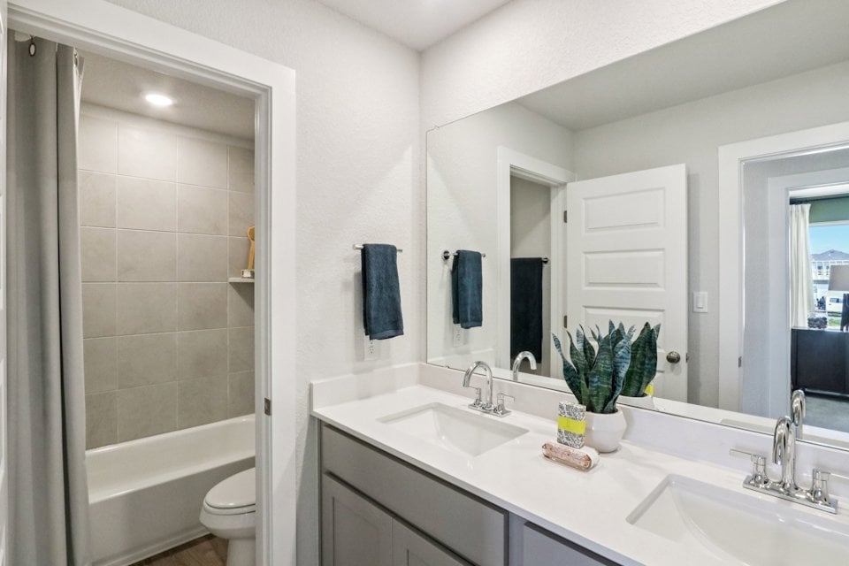 A bathroom with a sink and a toilet.