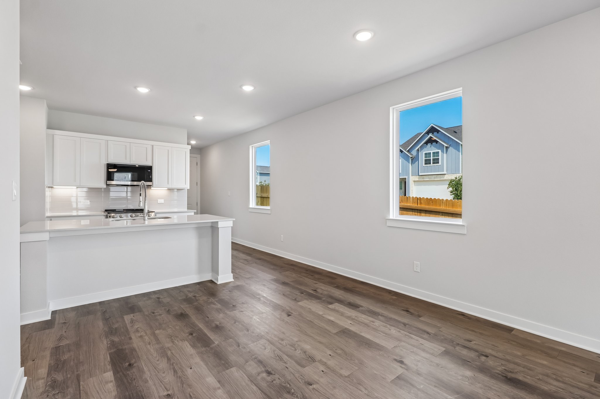 A kitchen with white walls.
