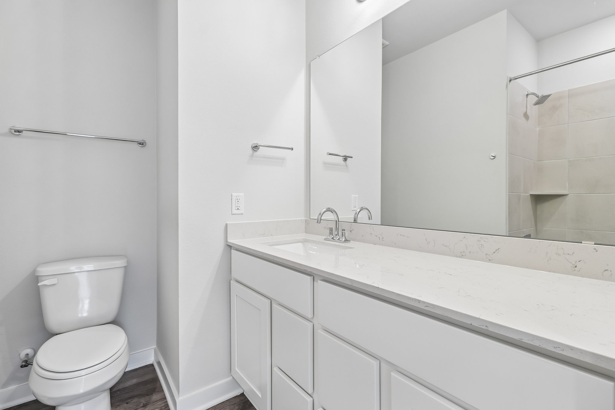 A bathroom with a tub toilet and sink.