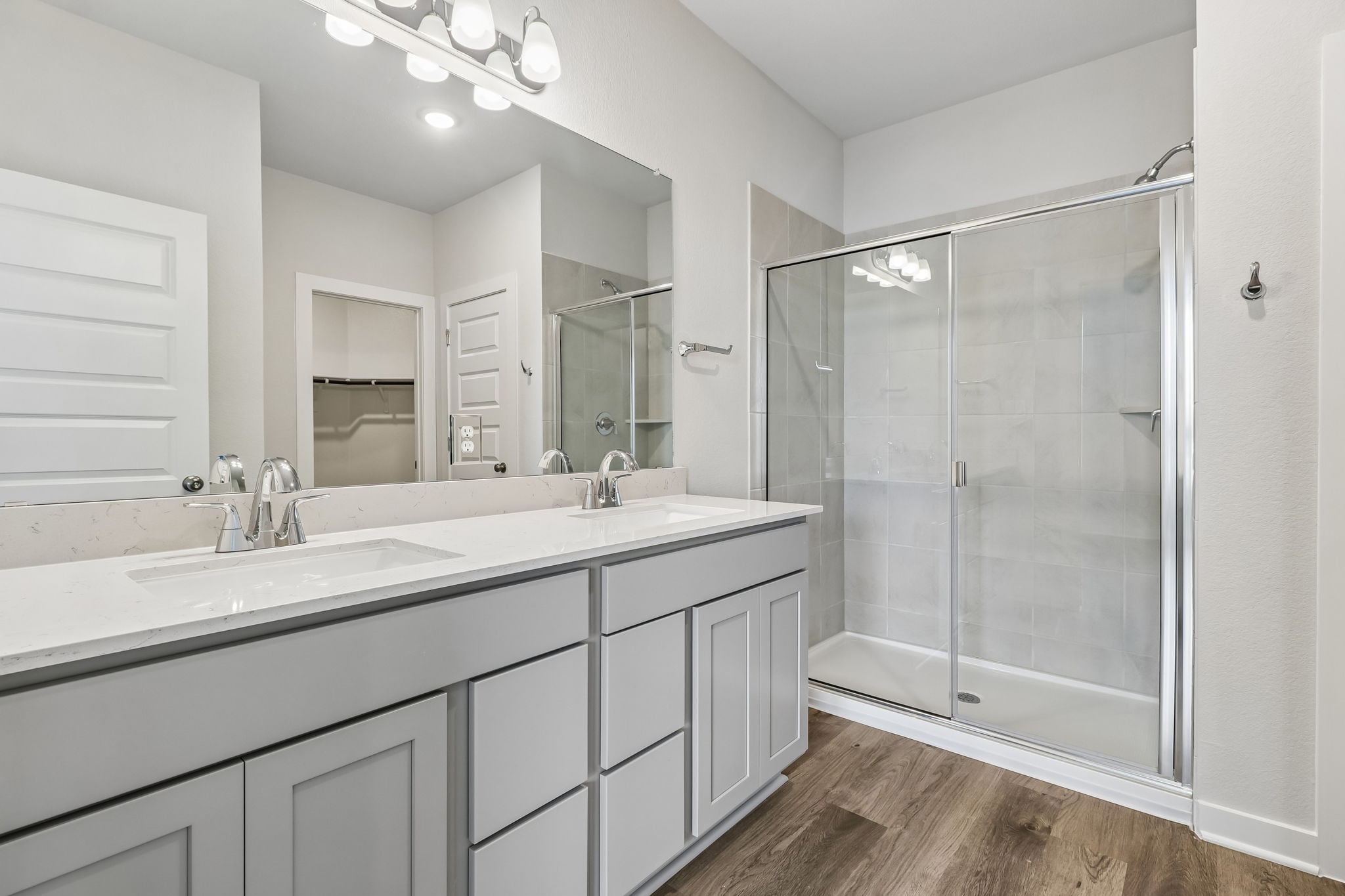 A bathroom with a glass shower.