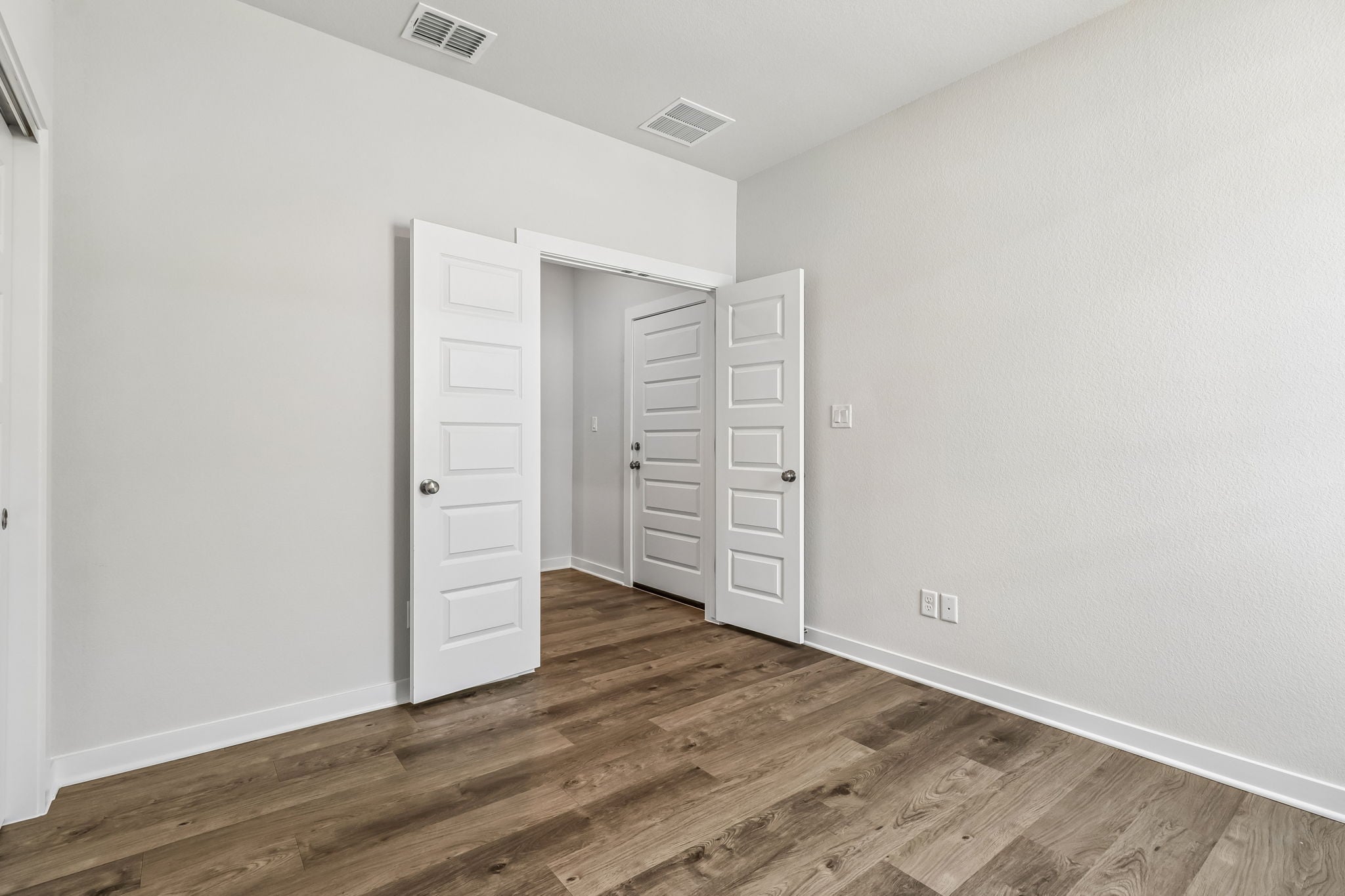 A room with white cabinets.
