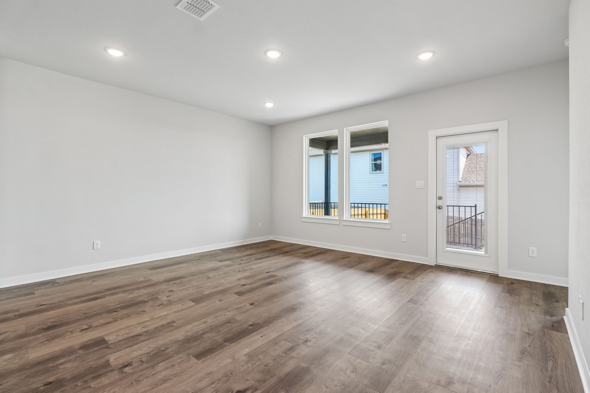 A room with a wood floor and a wood floor.