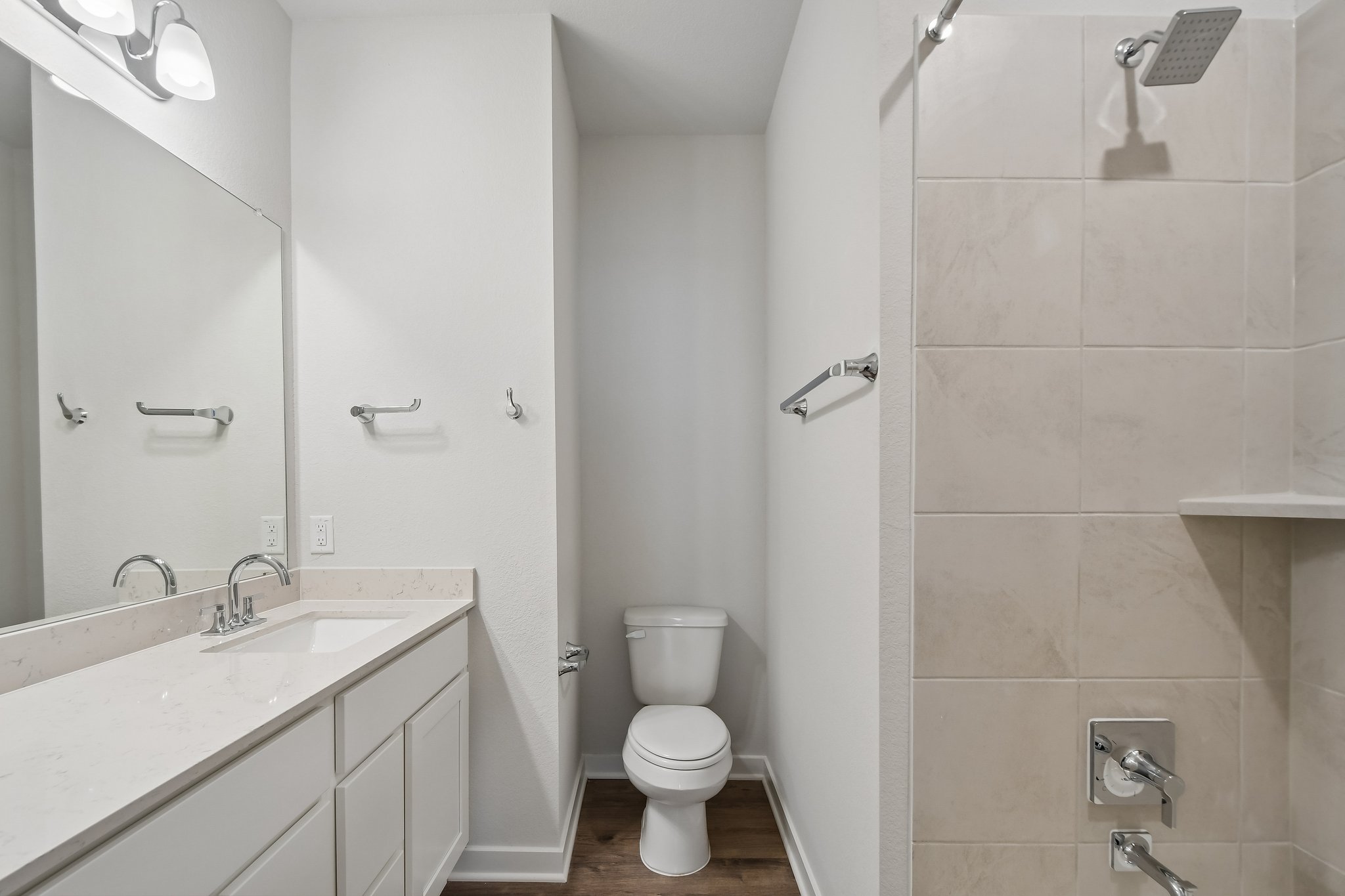 A bathroom with a toilet and sink.
