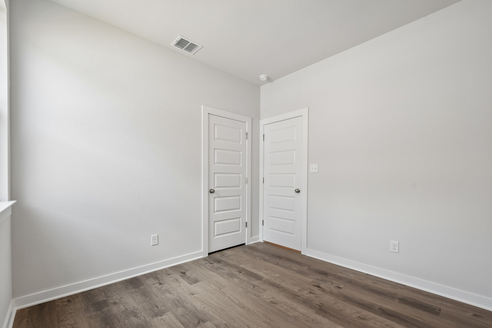 A room with white doors.