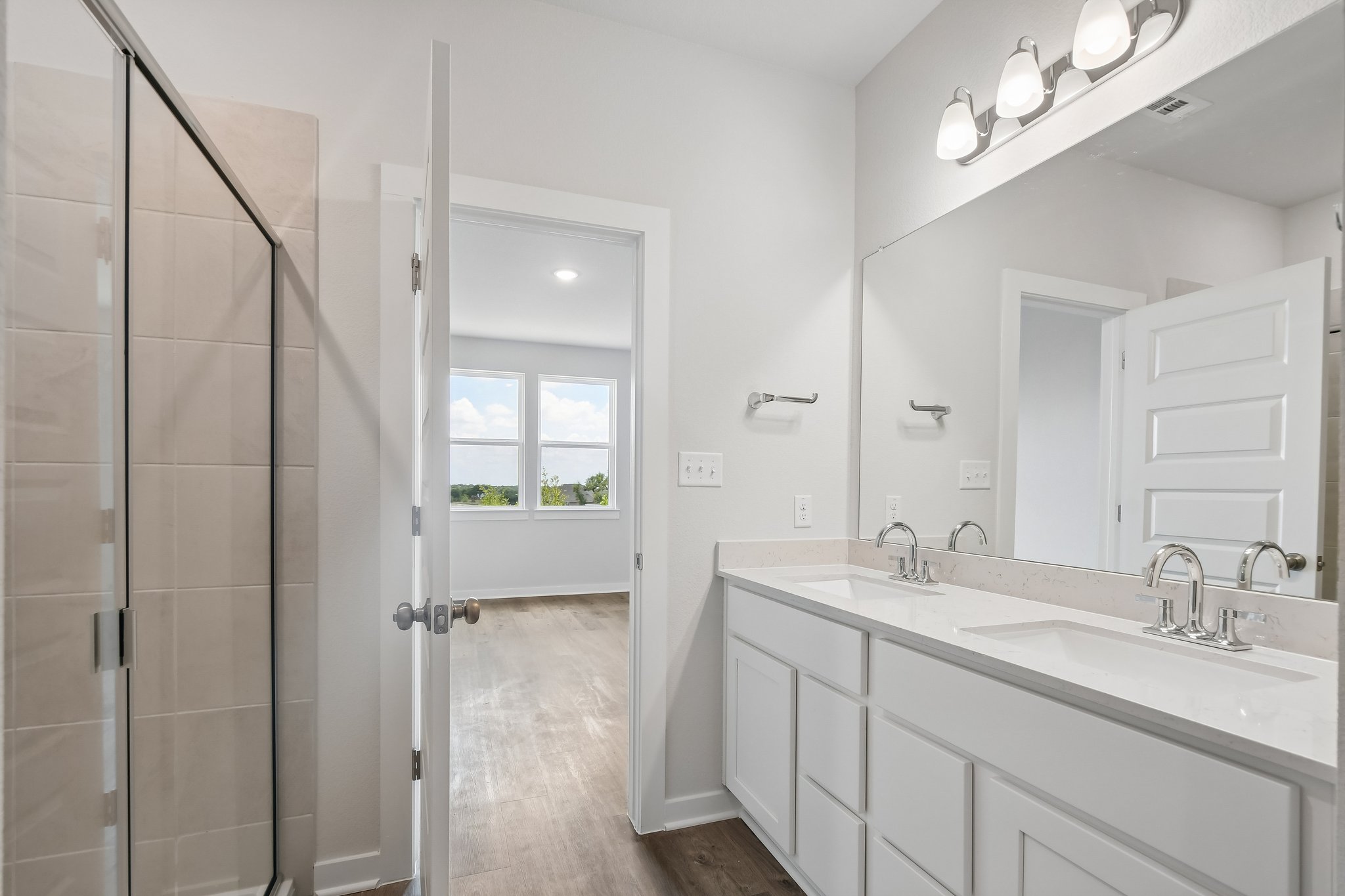 A bathroom with a glass shower.