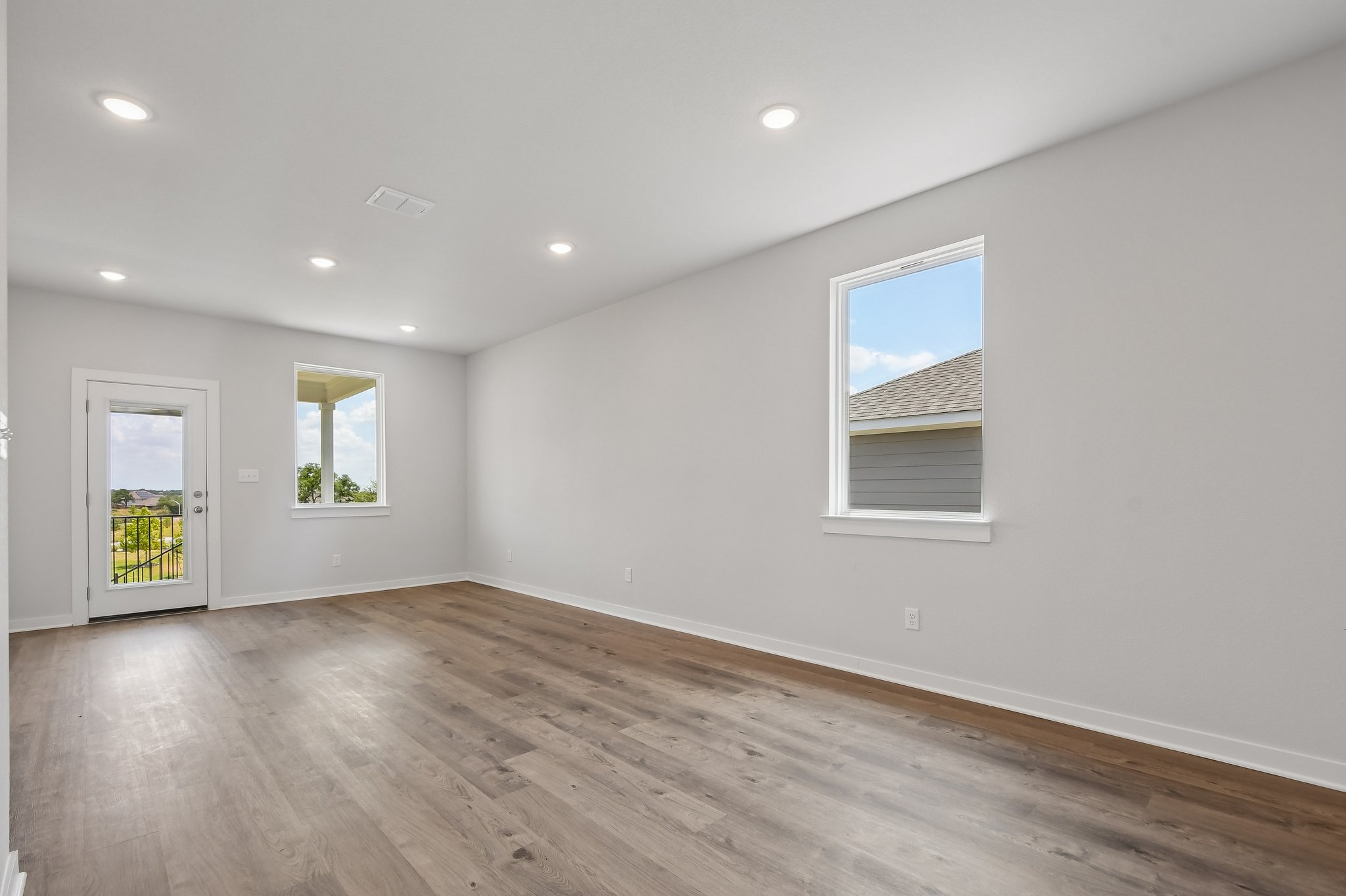 A room with white walls and windows.