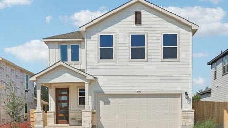 A white house with blue shutters.