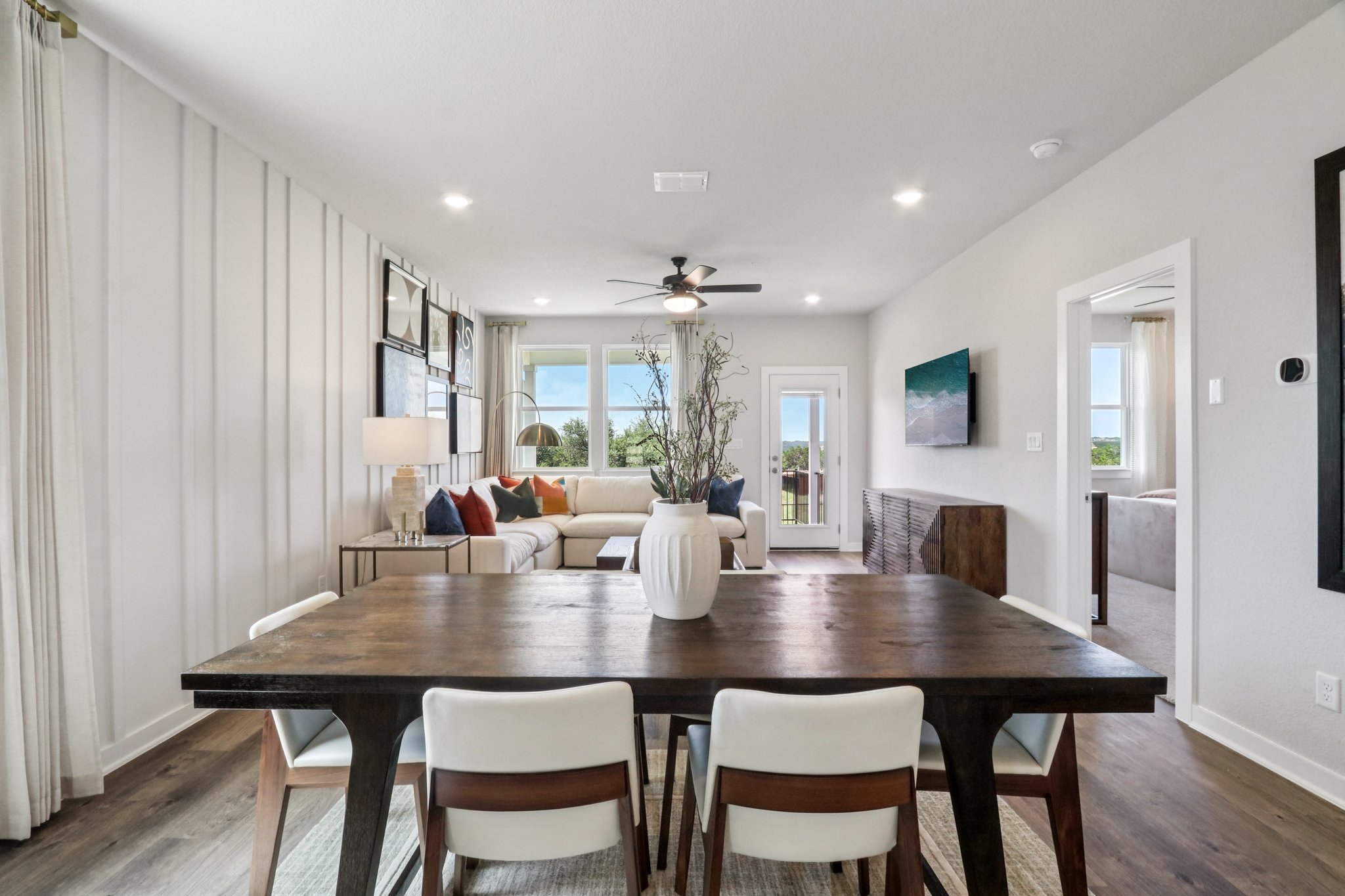 A dining room table with chairs.