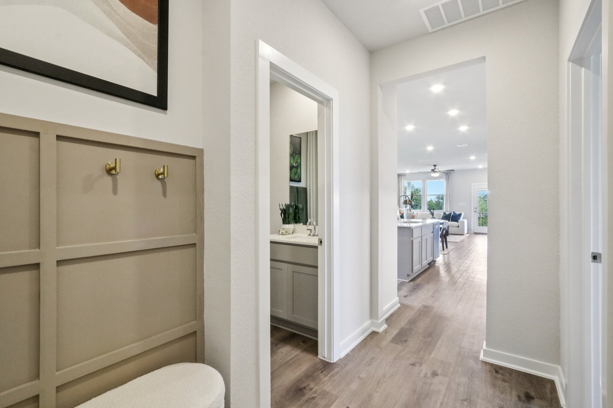 A bathroom with a wood floor.