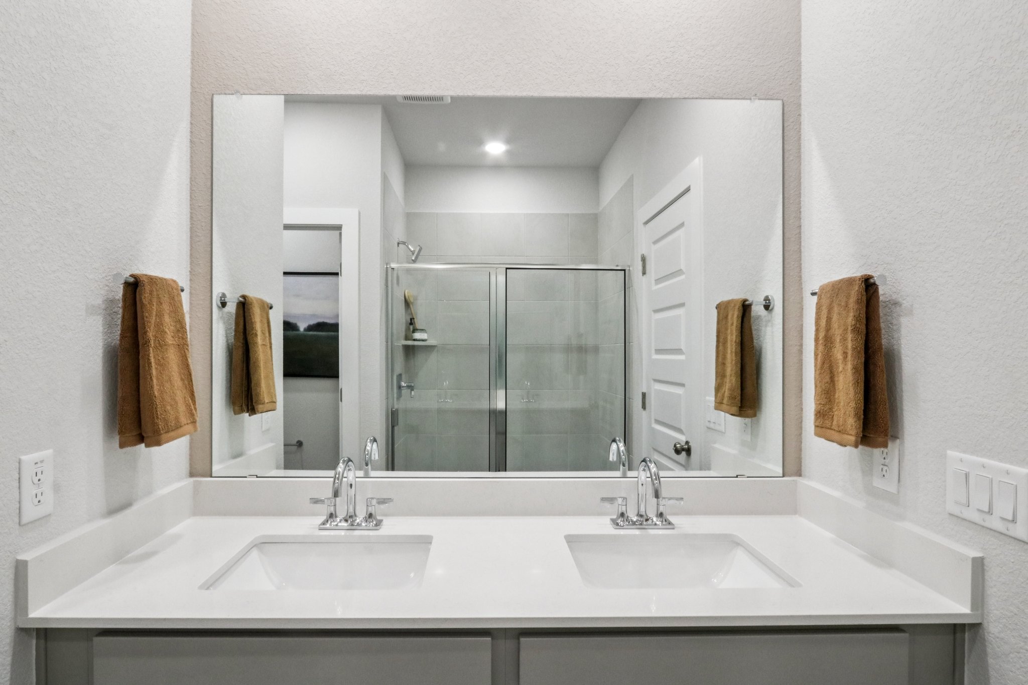 A bathroom with a glass shower.