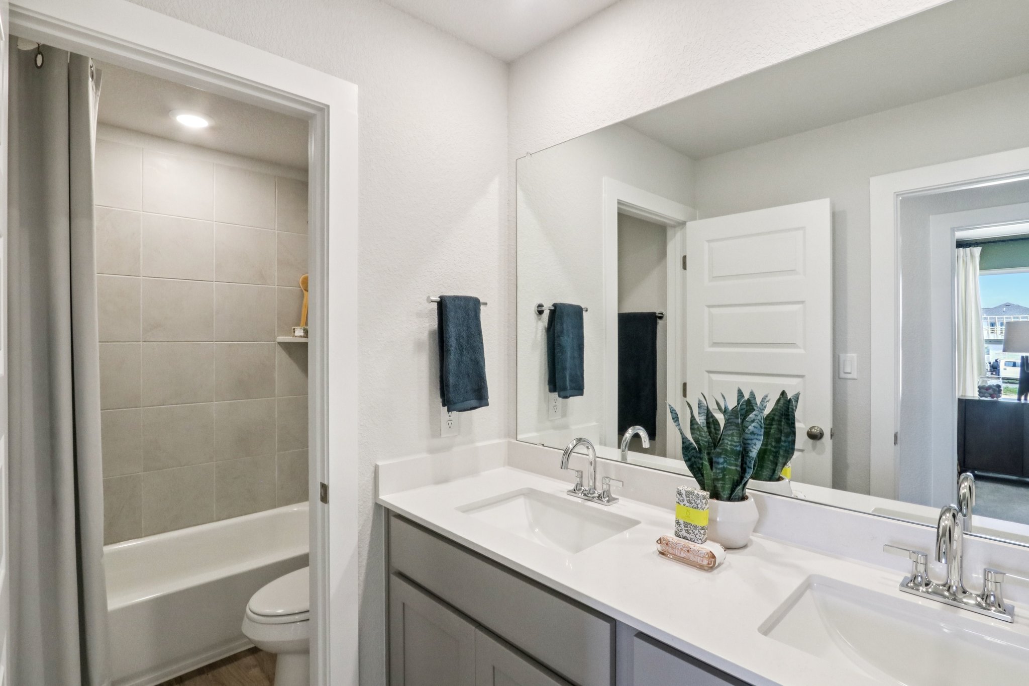 A bathroom with a sink and a toilet.