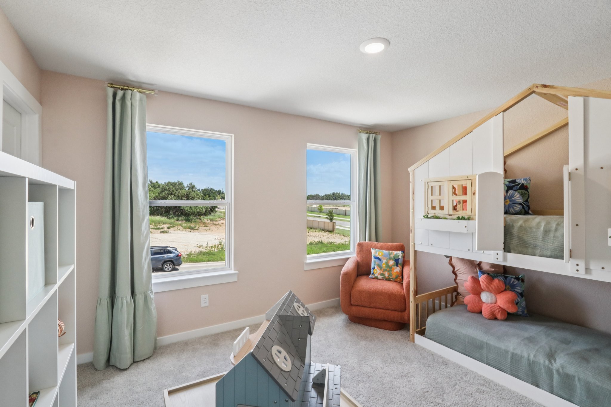 A living room with a couch and a window.