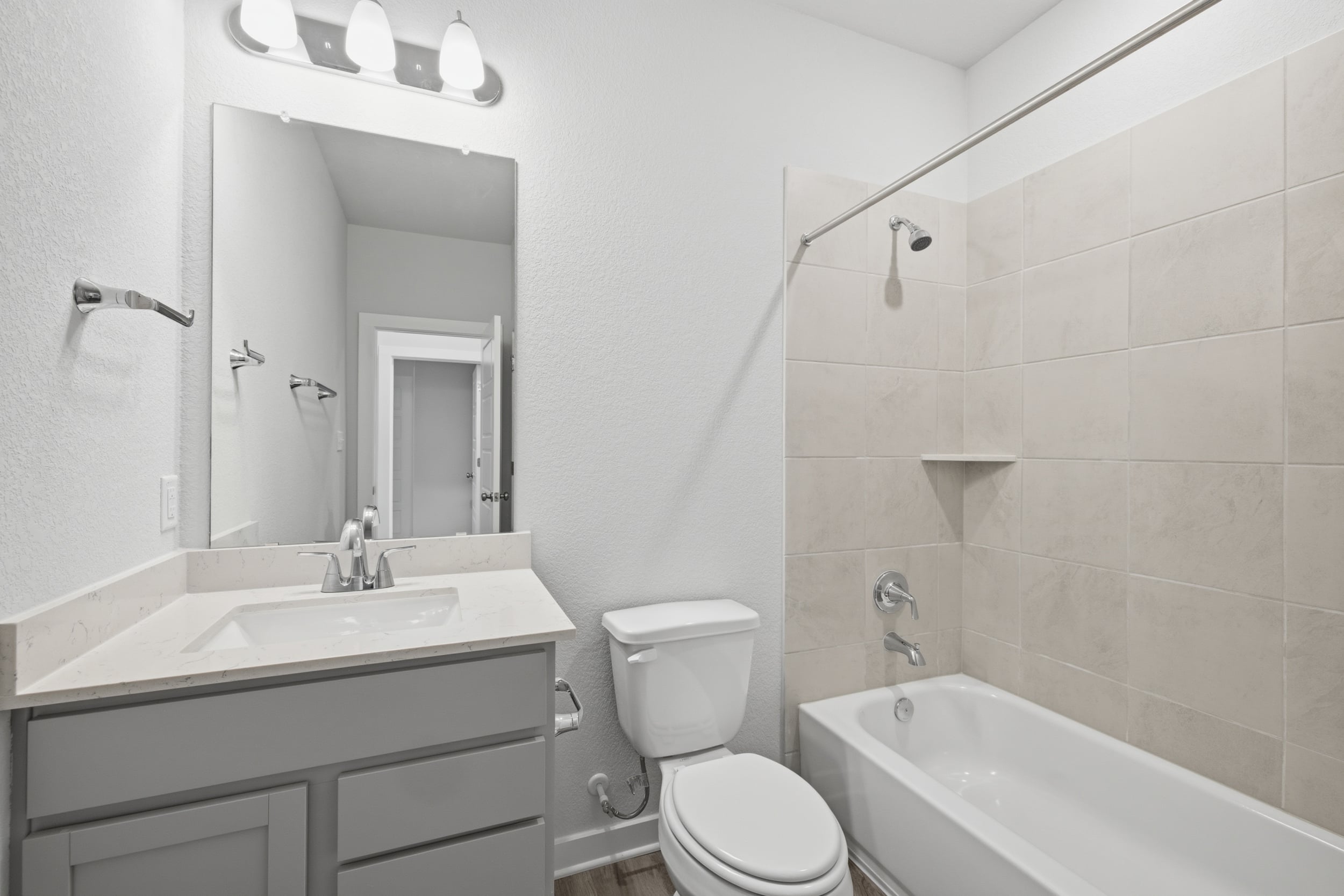 A bathroom with a toilet and sink.