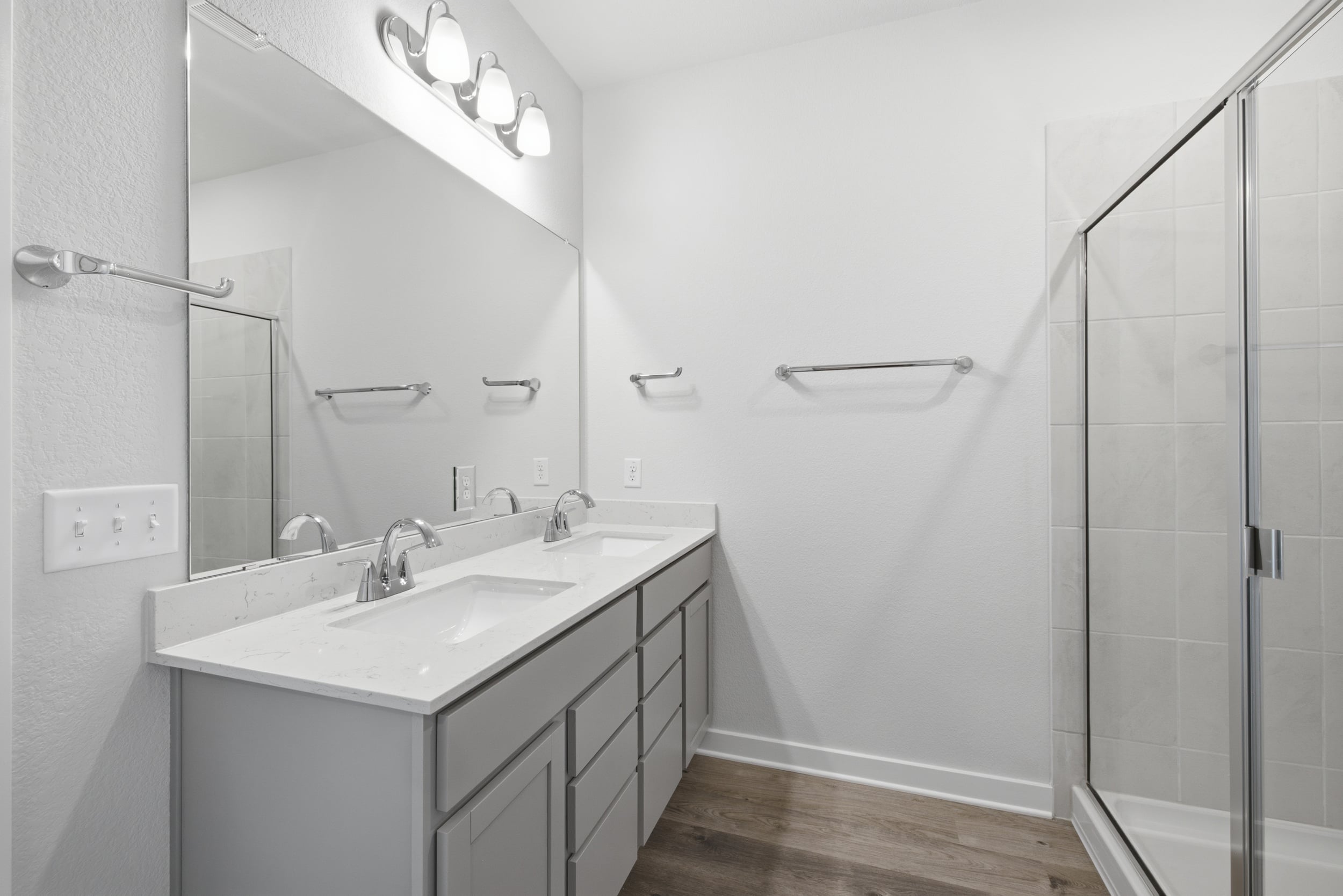 A bathroom with a glass shower.