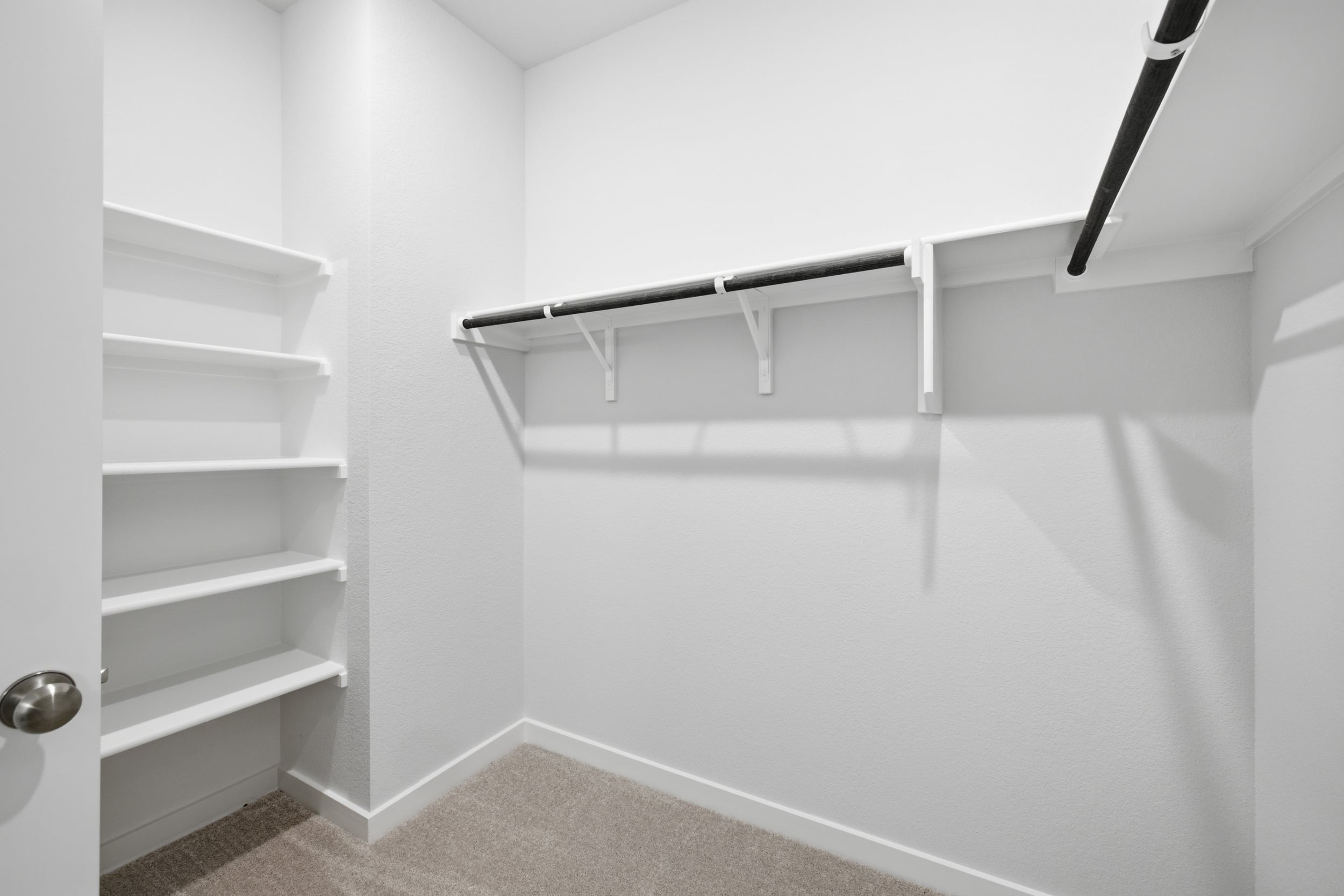A white bathtub in a room.