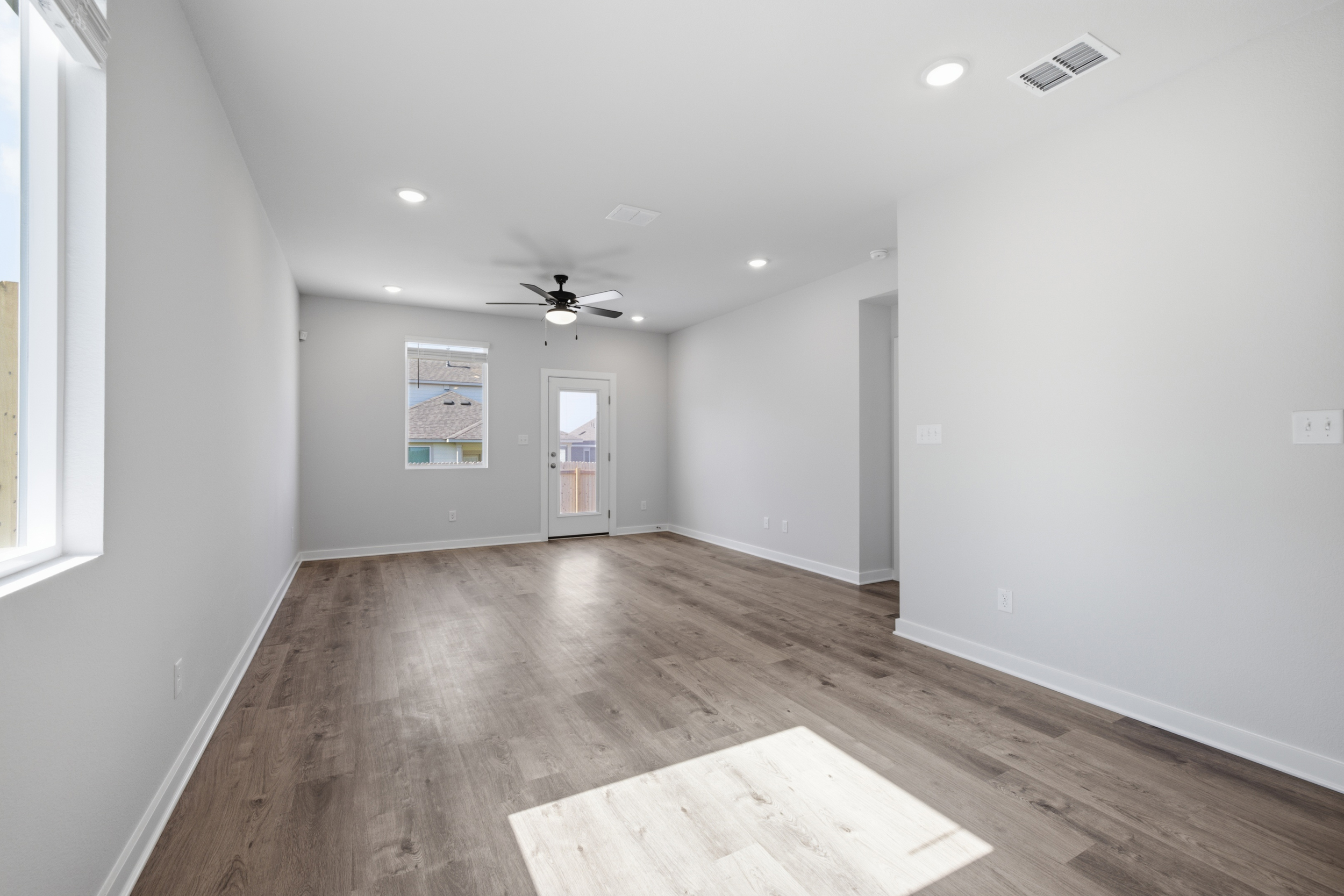 A room with a wood floor and a wood floor.