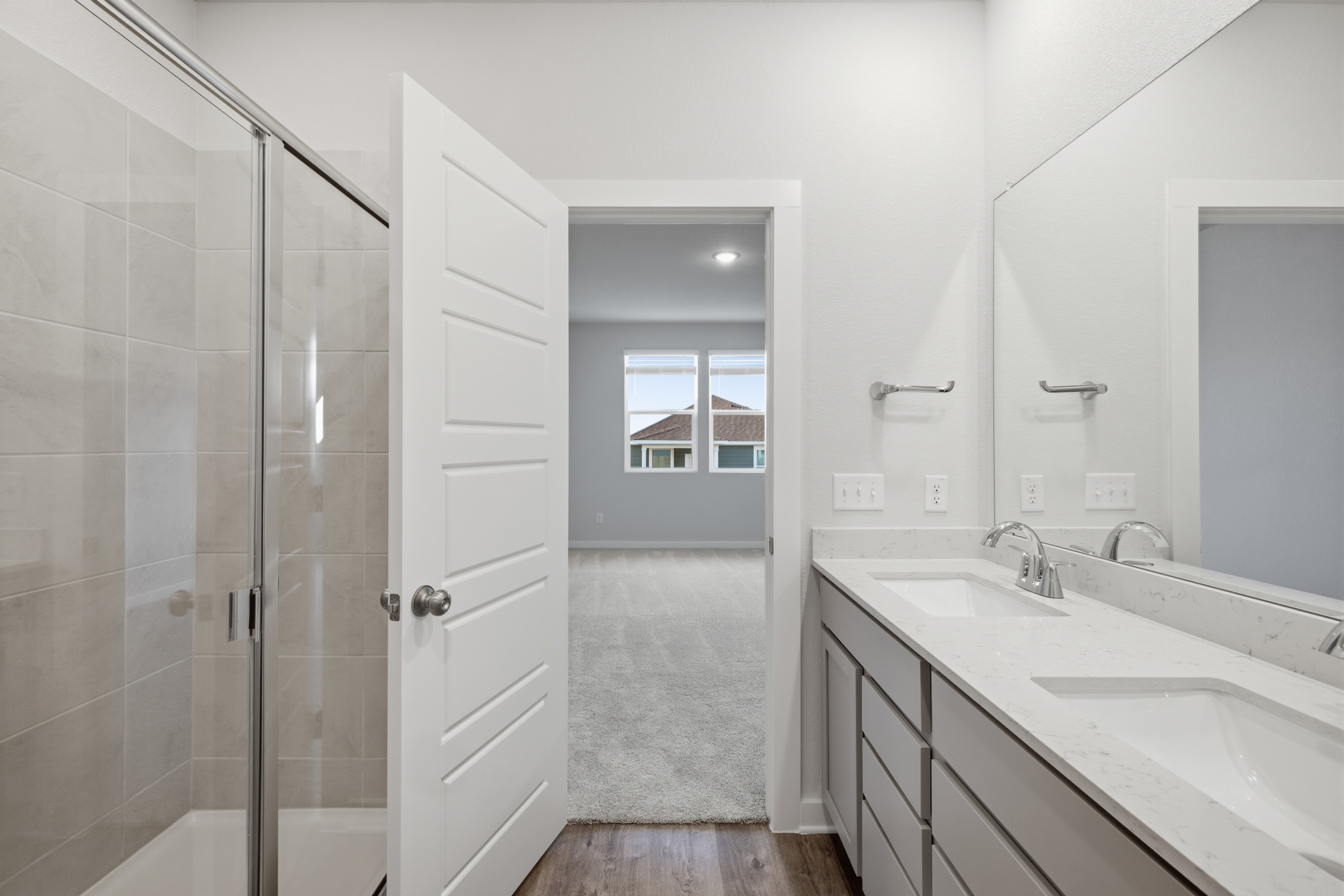 A bathroom with a glass shower.