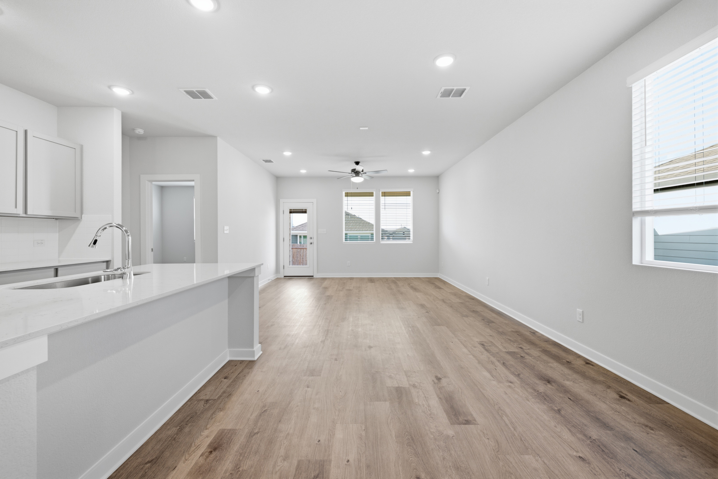 A kitchen with white walls.