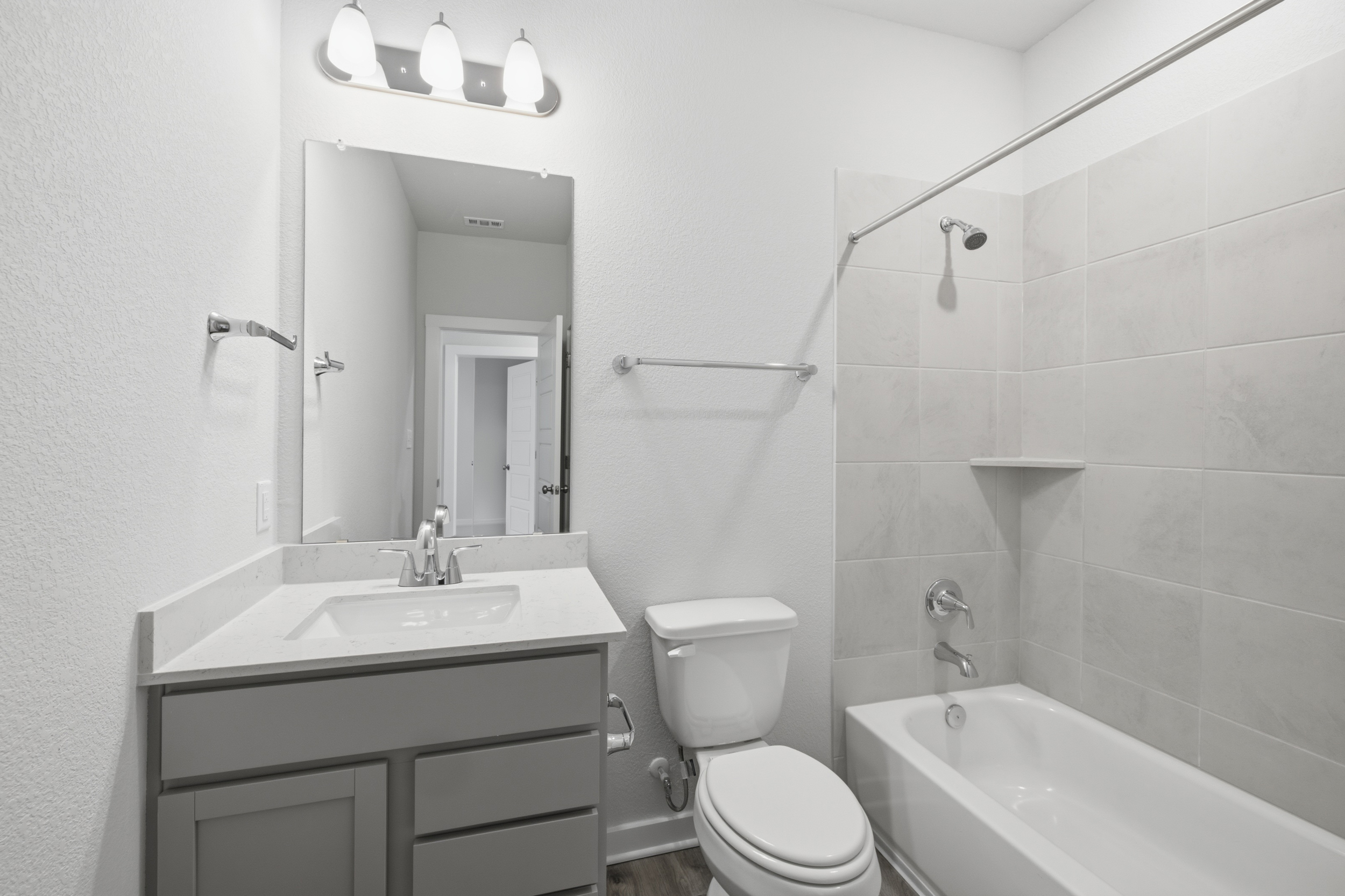 A bathroom with a toilet and sink.