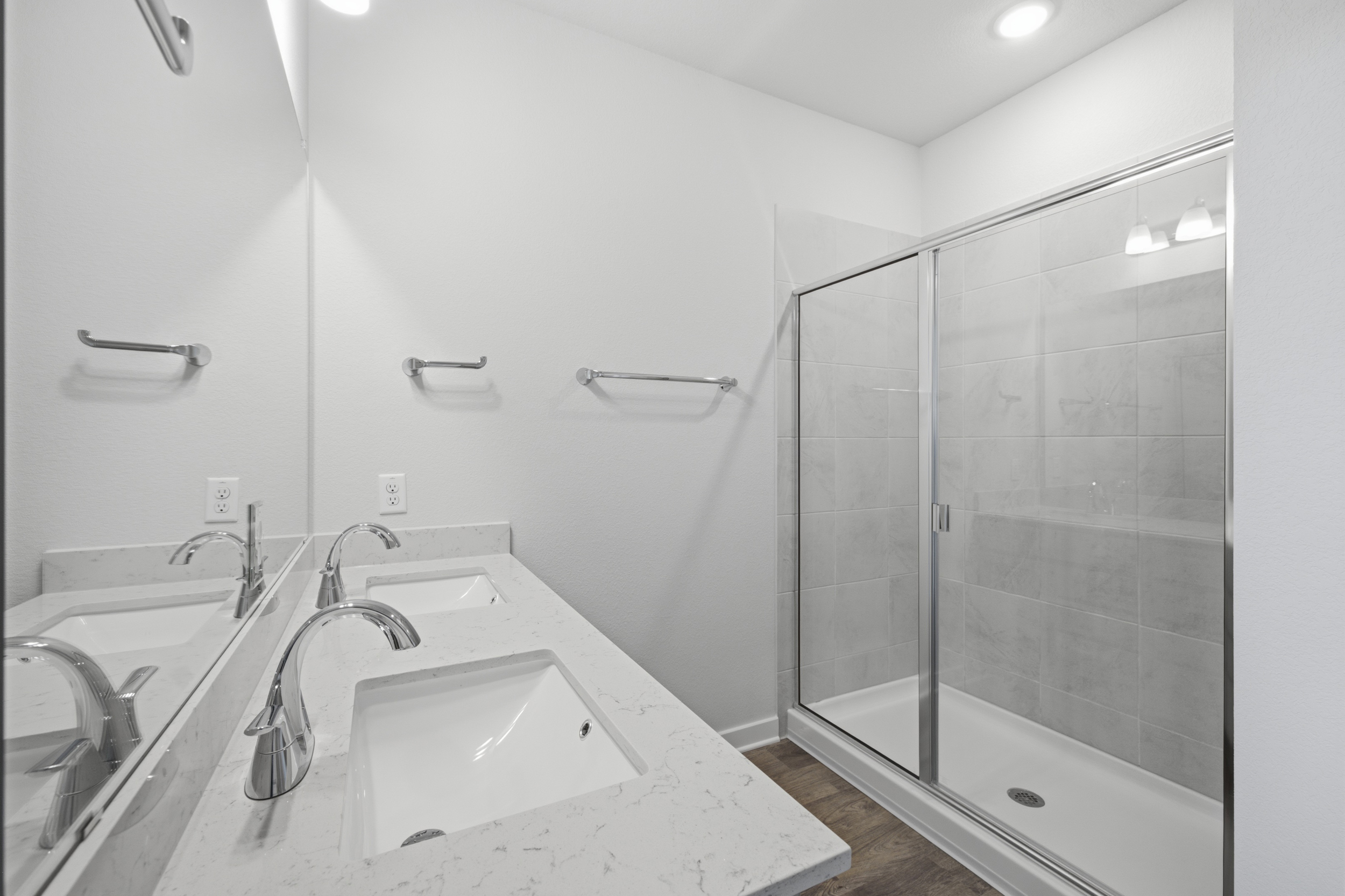 A bathroom with a glass shower.