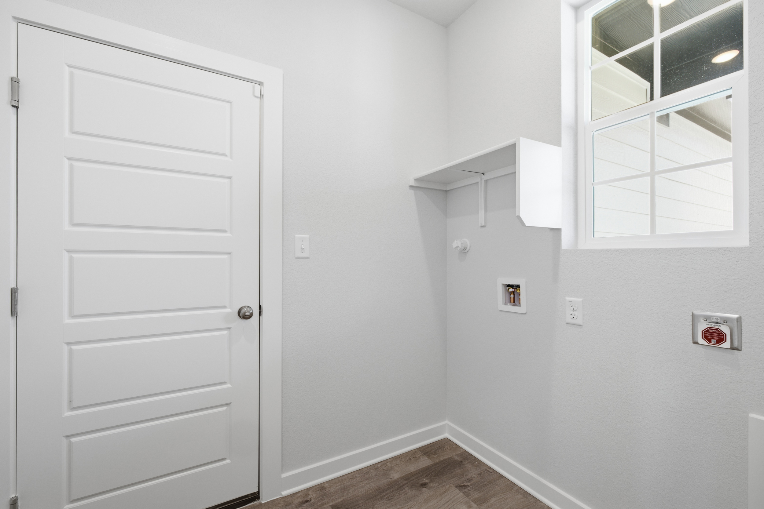 A white door with a mirror.