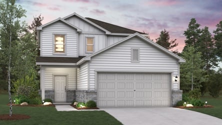 A white house with a garage.