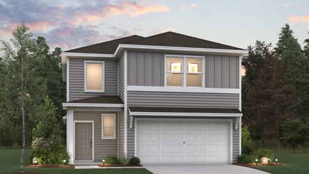 A house with a garage and trees.