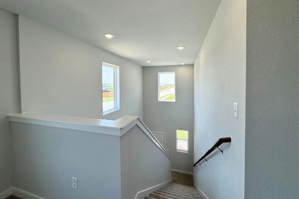 A bathroom with a shower unit.
