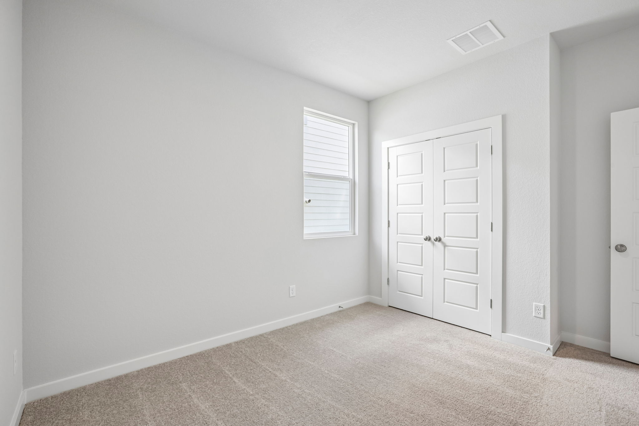 A room with white doors.