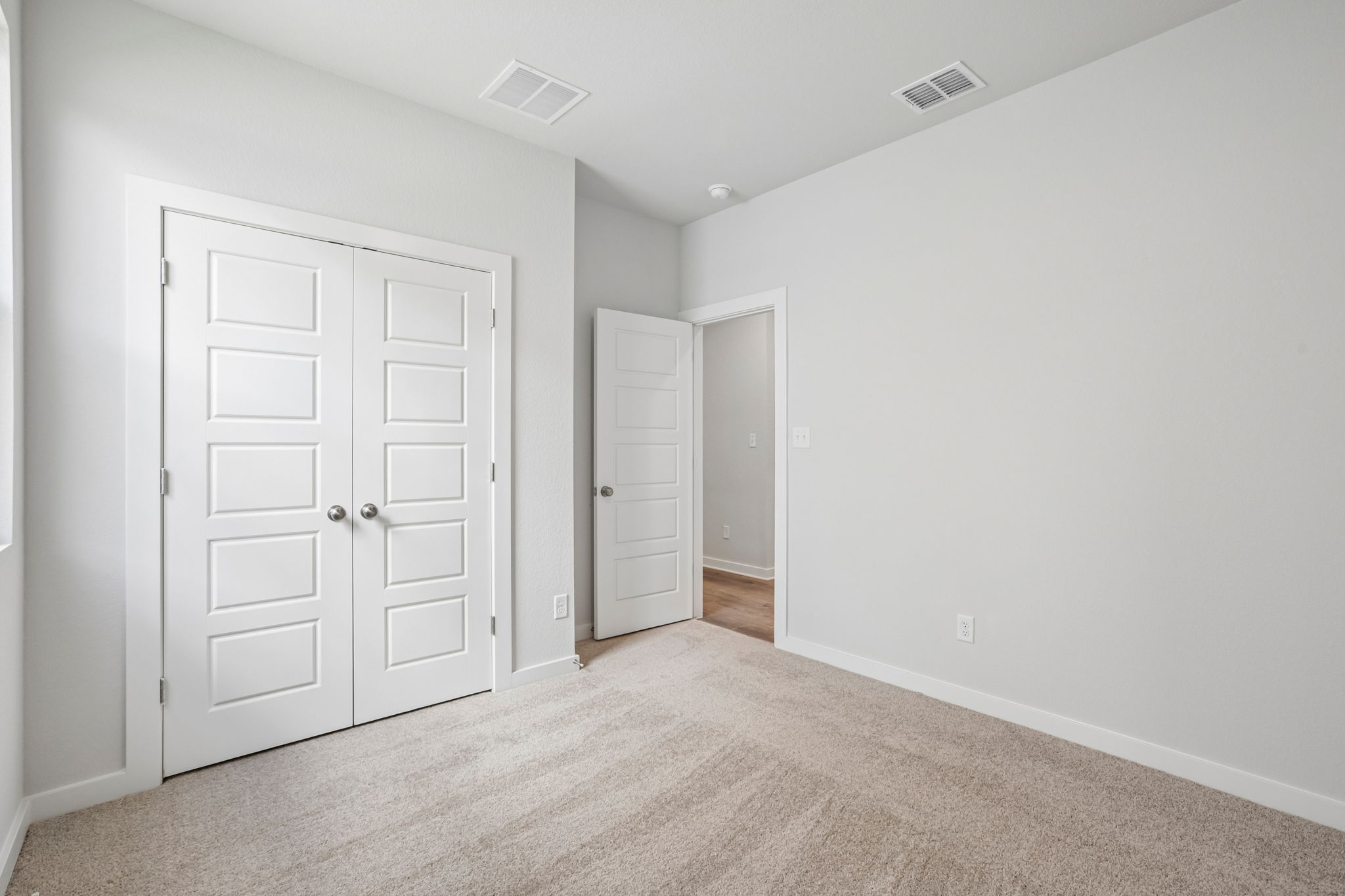 A room with white doors.