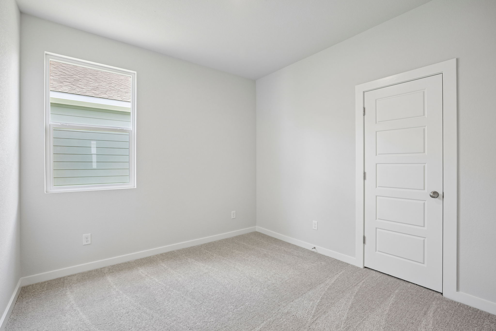 A room with a door and a window.