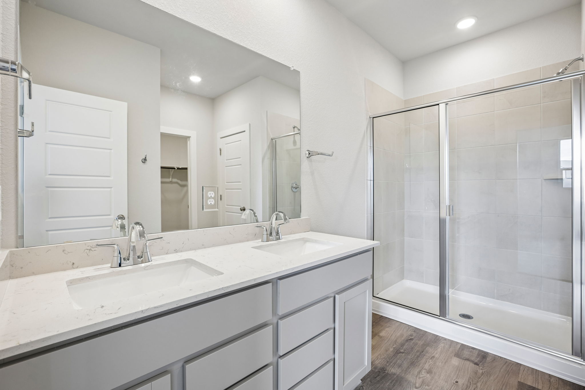 A bathroom with a glass shower.