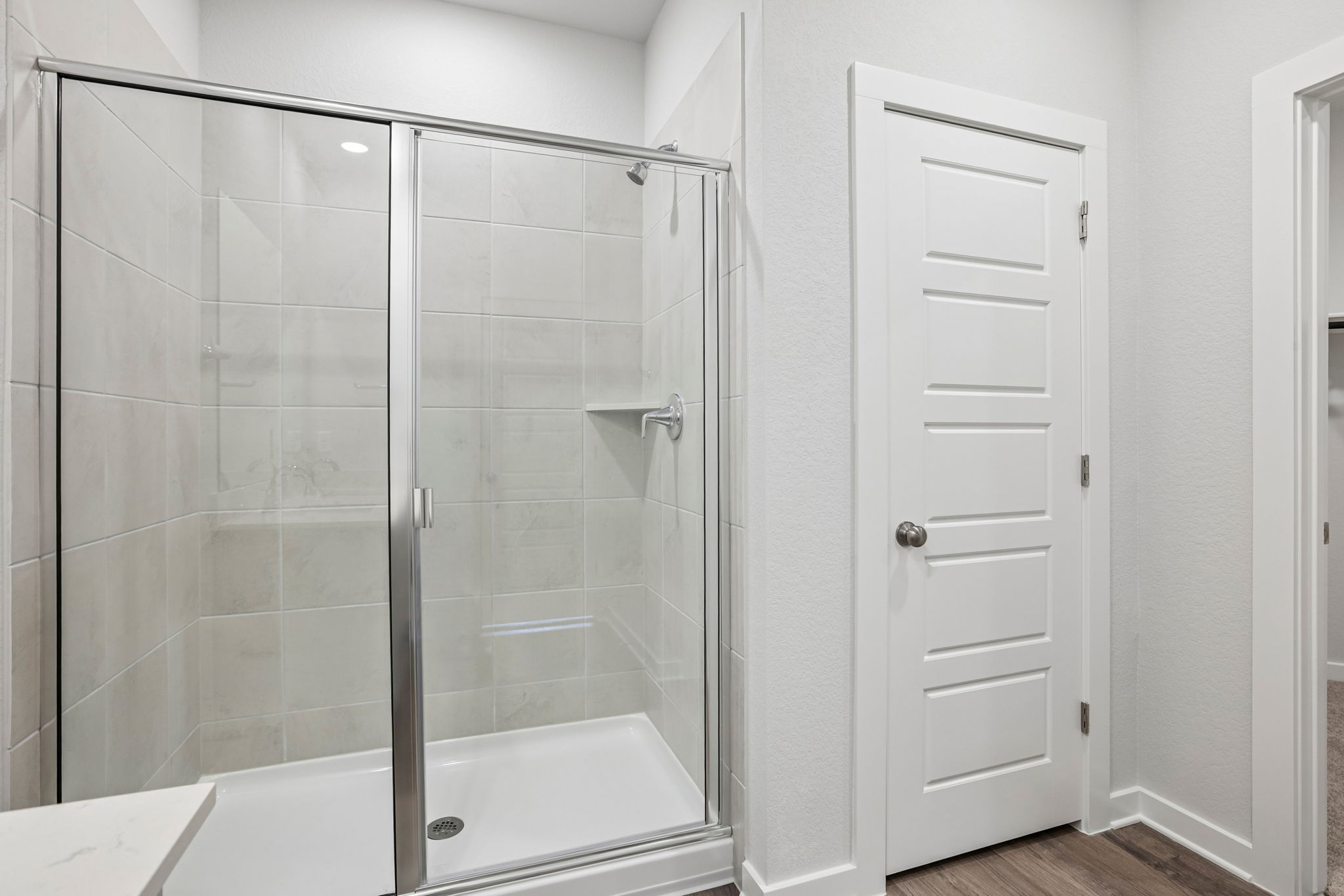A bathroom with a glass shower.