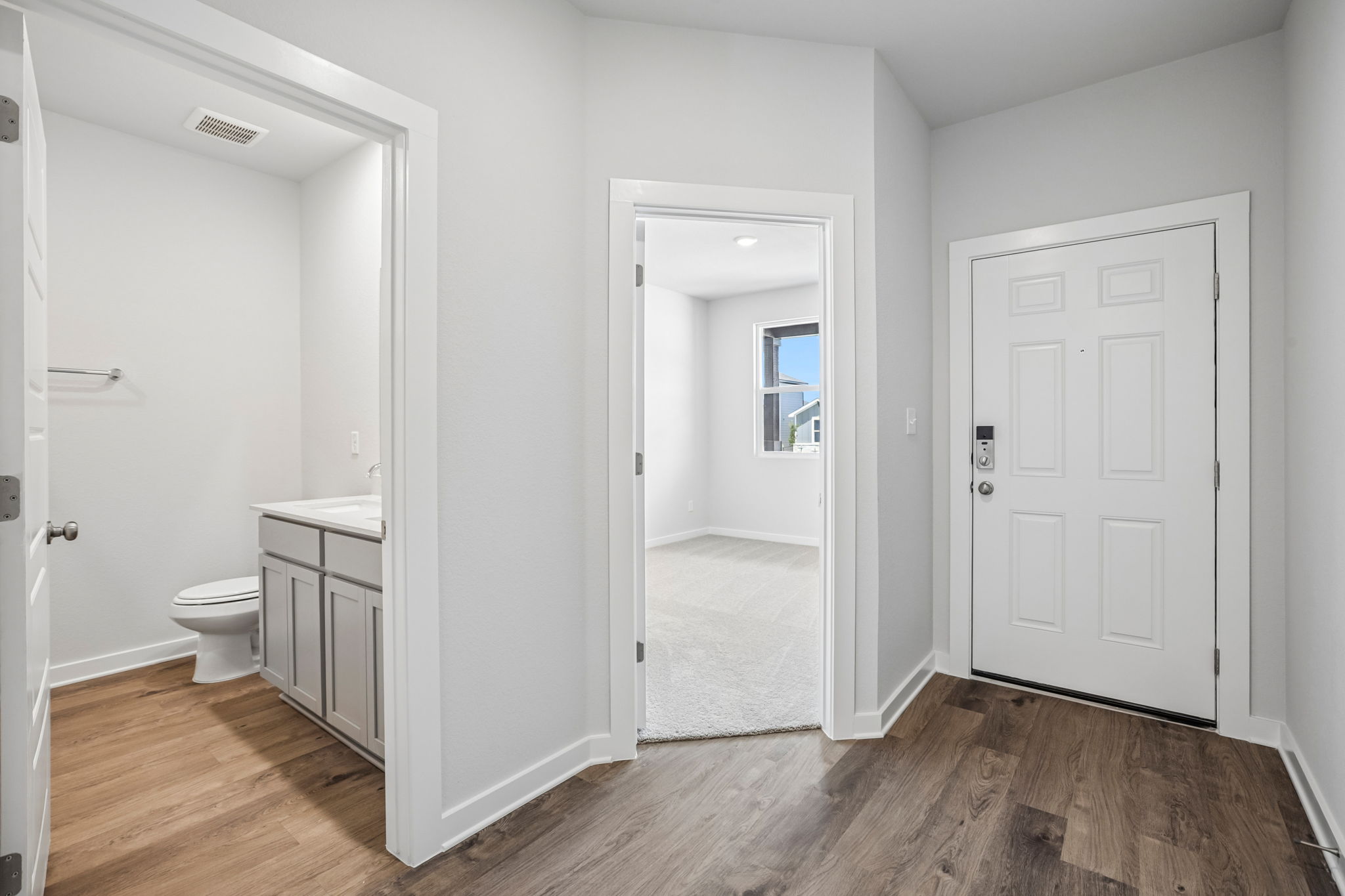 A bathroom with white doors.