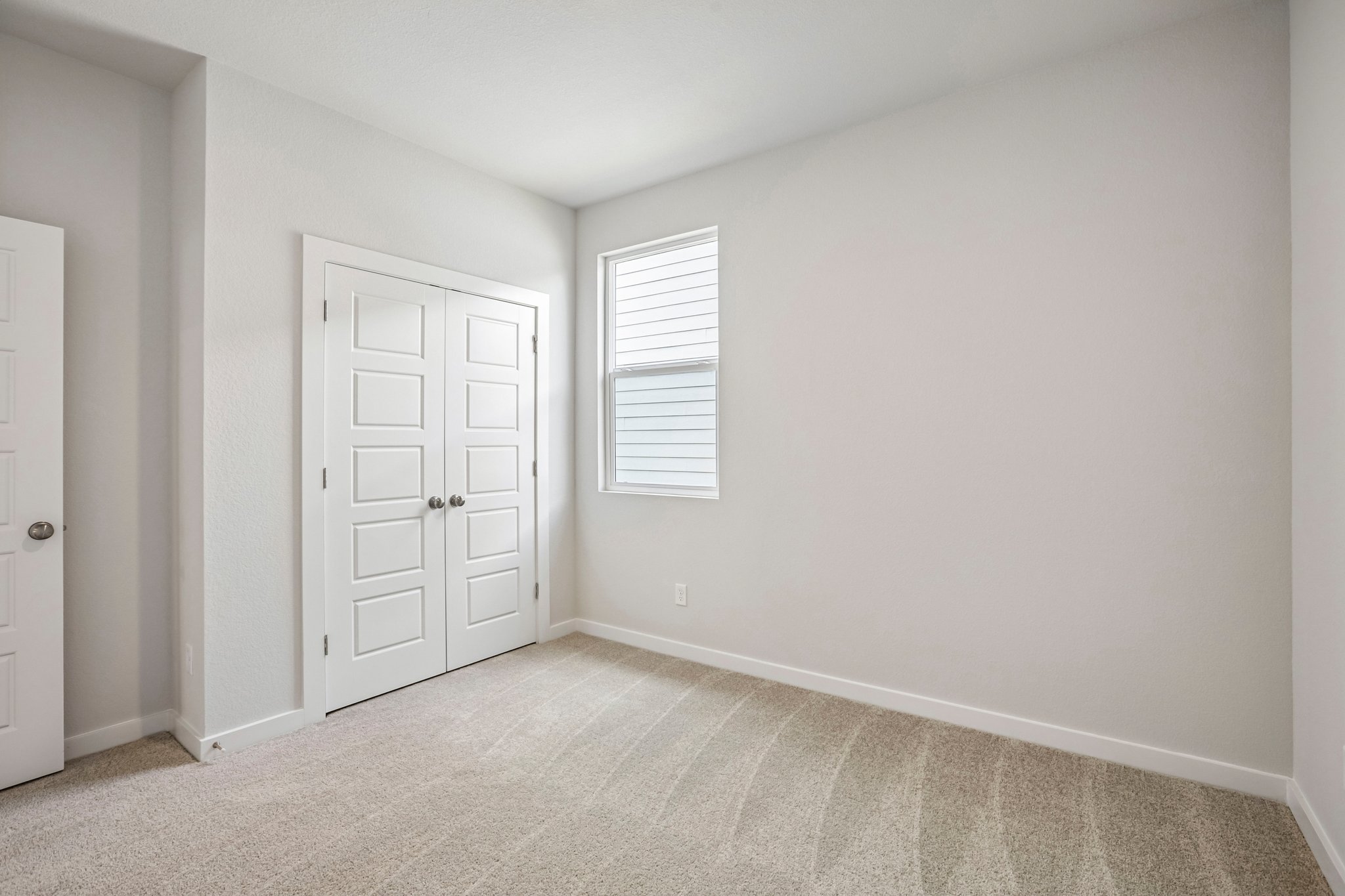 A room with white doors.